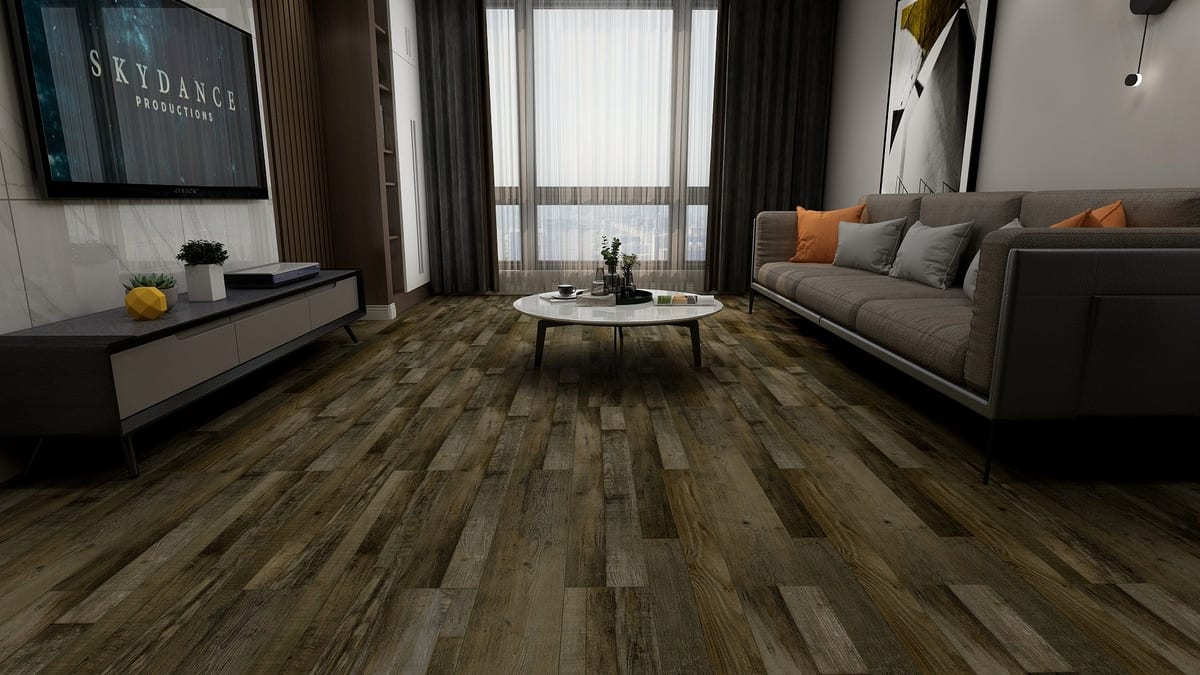 Dark reclaimed-look SPC floor in a media lounge