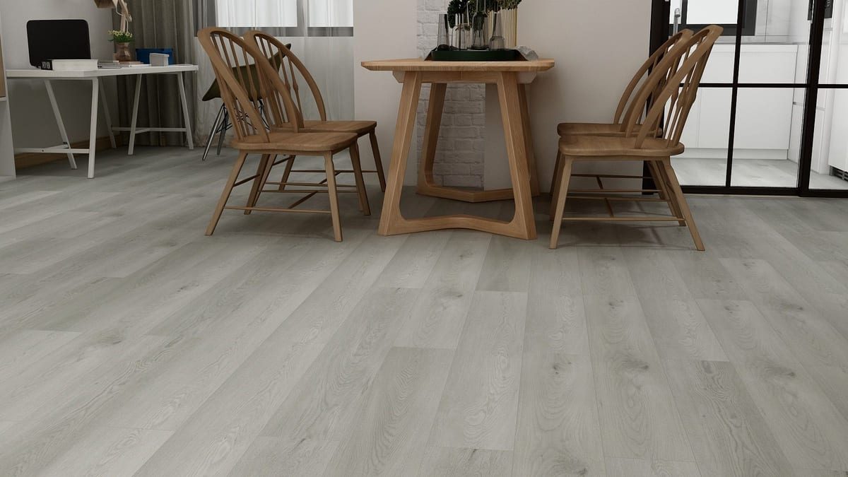 Silver-gray SPC floor beneath a wooden dining table